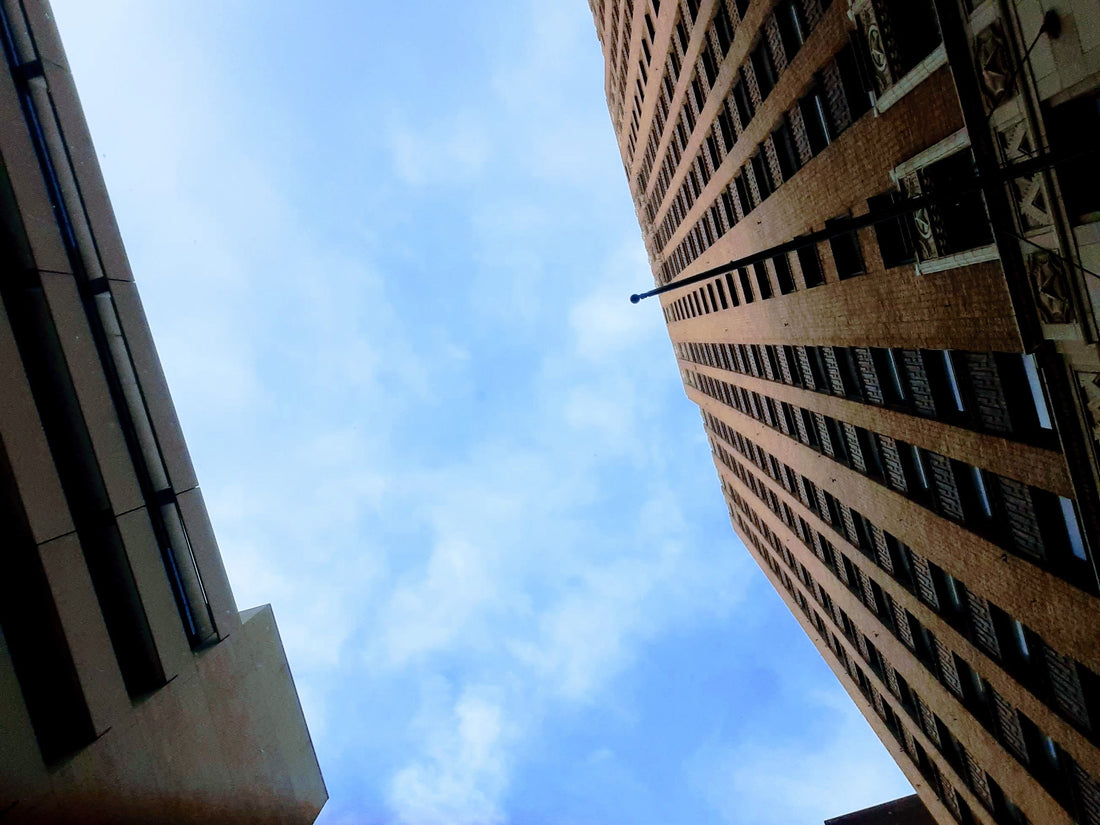 San Antonio Texas, as seen through the lens of MrsBunnyBrooks from the ground below two towering buiildings downtown